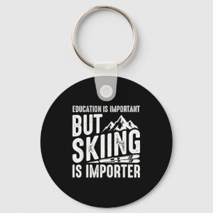 Education is important but skiing is importanter key ring