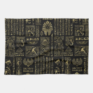 Egyptian hieroglyphs and deities gold on black tea towel