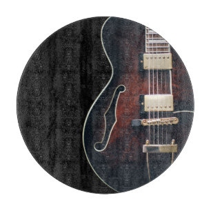 Electric Guitar On Black Cutting Board