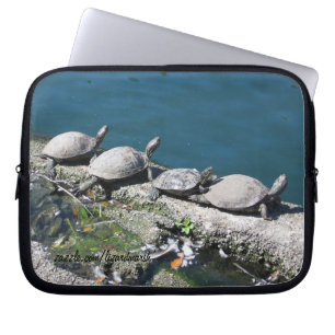 Electronics bag featuring family of turtles