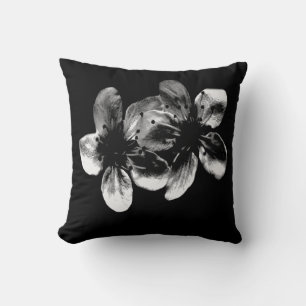 Elegance in Contrast: White Blossoms on Black Cushion
