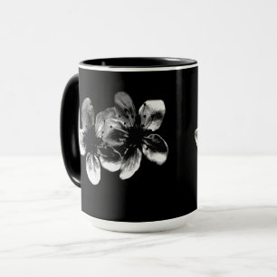 Elegance in Contrast: White Blossoms on Black Mug