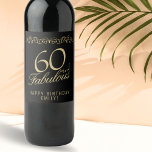 Elegant 60 and Fabulous Ornament 60th Birthday Wine Label<br><div class="desc">Elegant 60 and Fabulous Ornament 60th Birthday Wine Label. 60 and fabulous text in trendy golden script and an elegant ornament on black background. Personalise it with your name and your age,  and make personalised elegant wine labels for a woman`s birthday party.</div>