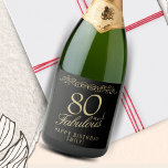 Elegant 80 and Fabulous Ornament 80th Birthday Sparkling Wine Label<br><div class="desc">Elegant 80 and Fabulous Ornament 80th Birthday Sparkling Wine Label. 80 and fabulous text in trendy golden script and an elegant ornament on black background. Personalise it with your name and your age,  and make personalised elegant wine labels for a birthday party.</div>