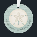Elegant Beach Sand Dollar Photo First Christmas Ce Ornament<br><div class="desc">A joyful Christmas ornament with a sand dollar and a weathered wood background for your 1st Christmas Celebration. Great for newlyweds. Put a beach honeymoon photo on the back. Personalise the front with your names and the year. Designed for you by Blackberry Boulevard.</div>
