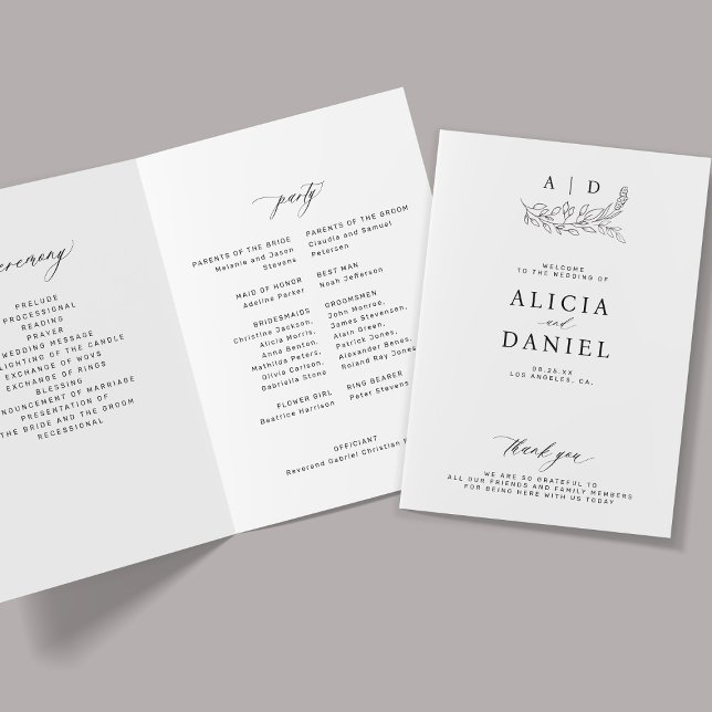 Elegant black and white monogram wedding  program (Creator Uploaded)