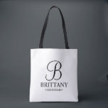 Elegant Black and White Personalised Bridesmaid Tote Bag<br><div class="desc">Elegant Black and White Personalised Bridesmaid Gifts
featuring personalised monogram in elegant calligraphy font style with bridesmaid's name and title in classic serif font style.

Also perfect for Maid of Honour,  Flower Girl,  Mother of the Bride and more.</div>