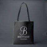 Elegant Black and White Personalised Bridesmaid Tote Bag<br><div class="desc">Elegant Black and White Personalised Bridesmaid Gifts
featuring personalised monogram in elegant calligraphy font style with bridesmaid's name and title in classic serif font style.

Also perfect for Maid of Honour,  Flower Girl,  Mother of the Bride and more.</div>