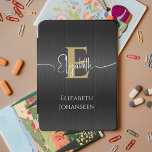 Elegant Black Brushed Metal Gold Monogram Trendy iPad Mini Cover<br><div class="desc">Elevate your iPad Air with our Elegant Black Brushed Metal Gold Monogram Trendy iPad Air Cover! Crafted from sleek black brushed metal, this cover exudes modern sophistication. Personalise it with your monogram in bold gold text and your script name in elegant white typography, adding a touch of personalised elegance to...</div>