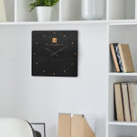 Elegant black gold monogram name personalised square wall clock<br><div class="desc">Luxury monogrammed square wall clock with a black leather look background and a faux gold copper metallic brushed square with elegant script signature name and monogram initials. Easy to personalise and create your own logo with your business or personal initials and name. Could be an elegant personalised gift for a...</div>