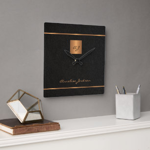 Elegant black gold monogram script name modern square wall clock