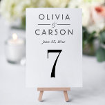 Elegant Black Serif Wedding Table Number Card<br><div class="desc">Bold black serif typography and clean lines on a crisp white background create a refined, modern wedding table number card. The couple's names and wedding date are displayed in a sophisticated typographic layout for a classic monogram design. The couple's names, date, and table number are easy to personalise. Each table...</div>
