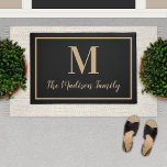 Elegant Black Tan Monogram Family Name Doormat<br><div class="desc">Your bestselling monogram doormat features your initial in refined tan serif typography framed by a classic double-line border with your family name in elegant script on a rich black background with warm gold accents. The luxurious black and tan color combination has proven irresistible to buyers looking for a polished entryway...</div>