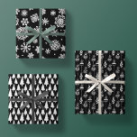 Elegant Black White Christmas Pattern Trio Gift Wrapping Paper Sheet<br><div class="desc">Elegant Black White Christmas Tree Pattern Gift Wrapping Paper Sheets. There  is a different modern black and white minimalist holiday pattern depicted on each sheet. 1.) christmas tree silhouettes   2.) cascading snowflakes of various designs and a range of sizes   3.) strings of ornate christmas decorative bulbs</div>