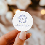 Elegant Blue Chinoiserie Crest Monogram Wedding Classic Round Sticker<br><div class="desc">Enhance your wedding details with our Elegant Blue Chinoiserie Monogram Crest wedding stickers. Featuring a beautiful blue baroque-style crest surrounding the couple's monogram, these stickers display names in classic blue calligraphy with the wedding date below. Perfect for sealing envelopes, decorating party favours, and adding a personalised touch to your celebration....</div>