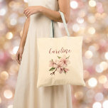 Elegant blush floral script cherry blossom wedding tote bag<br><div class="desc">Romantic blush pink blossoms and flowing script lettering create a soft, elegant name design perfect for bridesmaids and wedding party totes. This delicate floral artwork on a warm neutral background suits spring or summer celebrations and adds a feminine touch to any outfit. Simply add your chosen name to create a...</div>