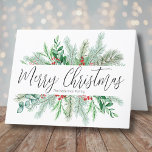 Elegant Botanical Greenery Merry Christmas  Holiday Card<br><div class="desc">A simple and classic Christmas card look with greenery like evergreen branches, leaves, and more. Subtle hints and pops of colour from the red holly berries give it a little something extra. In centre is 'Merry Christmas' in an elegant script typography as well as your family name or a business...</div>