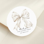 Elegant Bow Bridal Shower Gift Classic Round Sticker<br><div class="desc">"She's tying the knot" theme bridal shower favour bag with an elegant white bow design. Perfect for gift tag or envelope seal as well</div>