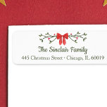 Elegant Bow & Holly Personalised Christmas Return  Return Address Label<br><div class="desc">Add a touch of festive elegance to your holiday mailings with this charming personalised Christmas return address label. Featuring a classic red bow with holly accents and customisable family name and address text, it’s perfect for sending holiday cheer with style. The refined red and green colour palette brings a cosy,...</div>