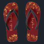 Elegant Bride Tribe Dark Burgundy & Gold Foliage  Thongs<br><div class="desc">These elegant bride tribe dark burgundy and gold foliage pattern flip flops have a dark burgundy background that is adorned with an intricate gold floral greenery pattern and customisable modern typography. The combination of the rich burgundy and the shimmering gold create an elegant and luxurious aesthetic. It's a beautiful gift...</div>