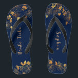 Elegant Bride Tribe Gold Foliage Navy Blue Thongs<br><div class="desc">These elegant bride tribe gold foliage pattern navy blue flip flops have a dark blue background that is adorned with an intricate gold floral greenery pattern and customisable modern typography. The combination of the rich navy and the shimmering gold create an elegant and luxurious aesthetic. It's a beautiful gift for...</div>