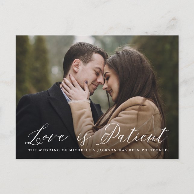 Elegant Calligraphy Love is Patient Postponement Announcement Postcard (Front)