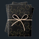 Elegant Decorative Heart Charms Gold and Black Wrapping Paper Sheet<br><div class="desc">The artwork features charming decorative hearts in an elegant pattern in gold and black colour scheme. 
For questions,  contact the artist at wafadahdalcreates@gmail.com. © Wafa Y. Dahdal - All Rights Reserved. WD Art</div>