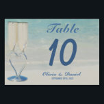 Elegant destination beach wedding table number<br><div class="desc">Elegant destination beach tropical wedding Table Number. A coastal photo and two wedding champagne glasses with heart-shaped base. Ideal for summer beach weddings. You can change text or background.</div>