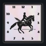 Elegant Dressage Rider on a Watercolor Background Square Wall Clock<br><div class="desc">A clock with a black and white illustration of a dressage rider. The horse and rider are performing a pirouette. Classy and beautiful. Set on a watercolor background in delicate and muted pastel colors.</div>