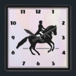 Elegant Dressage Rider on a Watercolor Background Square Wall Clock<br><div class="desc">A clock with a black and white illustration of a dressage rider. The horse and rider are performing a pirouette. Classy and beautiful. Set on a watercolor background in delicate and muted pastel colors.</div>