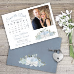 Elegant Dusty Blue Floral Calendar Photo Wedding Save The Date<br><div class="desc">This beautiful wedding Save the Date card features a rustic boho chic design with a cluster of hand painted watercolor roses, blossoms, and eucalyptus leaves in shades of dusty blue and sage green. The left side of the card is a customizable calendar of your wedding month with a heart around...</div>