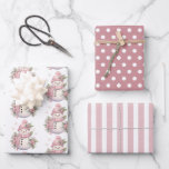 Elegant Floral Christmas Snowman Wrapping Paper Sheet<br><div class="desc">Add a special touch to your holiday gift-giving this season with this elegant pink green and white floral Christmas snowman gift wrapping paper. This stunning gift wrap features a beautifully designed watercolor floral snowman, polka dot and striped pattern design. Add a personal touch by including a family name or your...</div>