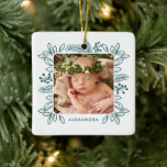 Elegant Foliage Frame First Christmas Teal Photo Ceramic Ornament<br><div class="desc">This darling first Christmas ornament features a pretty foliage and pine frame in teal blue green, surrounding your photo. There's a text template for baby's name on the front, as well as more text templates on the back for further personalisation. Create a precious keepsake to treasure for years to come!...</div>