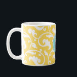 Elegant girly yellow floral pattern monogram coffee mug<br><div class="desc">Chic elegant stylish feminine decorative swirl yellow floral pattern design, the cute girly retro modern floral pattern in yellow and teal blue give this elegant retro design a contemporary, unique and feminine look. Cool unique gifts for her. Custom the personalised monogram with your own initial or name, you can also...</div>