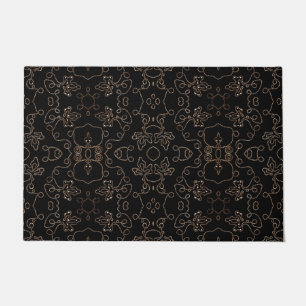 Elegant gold embellishments on black doormat