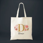Elegant Gold Monogram Name Pink Floral Tote Bag<br><div class="desc">A beautiful, feminine monogrammed pink floral tote bag featuring pink flowers and a faux gold monogram letter "D". Personalise the tote bag by adding your name underneath the monogram. Makes a fun gift for a friend or for a bridesmaid gift. Find your initial monogram in the shop. Designed for you...</div>