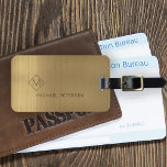 Elegant golden monogrammed name modern luggage tag<br><div class="desc">Modern luxury exclusive looking luggage tag on a faux metallic brushed gold background with geometric diamond shaped monogram. Personalise it with your name,  monogram,  and details on both sides!</div>