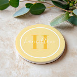 Elegant Golden Yellow Round Monogram Script Coaster<br><div class="desc">An elegant sandstone coaster featuring a golden yellow serif initial and custom family name in script, framed by a white circle on a warm yellow background. The sunny, cheerful palette brings a bright, welcoming energy to any tabletop. A fun personalised gift for housewarmings, birthdays, or summer entertaining. All text is...</div>
