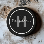 Elegant Grey Black Round Custom Monogram Initial Coaster<br><div class="desc">Elegant round personalised beverage drink coaster design features a classic custom serif monogram initial in pewter grey with your last name / surname in modern white calligraphy script against a black background. A simple white circle frames the design. Colour scheme can be customised to coordinate perfectly with your home decor....</div>