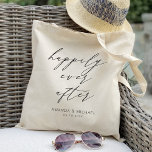 Elegant Happily ever after Personalised Wedding Tote Bag<br><div class="desc">This personalised wedding tote bag is the perfect accessory for any bride-to-be or newlywed couple. The design features an elegant script font with the words "Happily Ever After" in a delicate calligraphy style, making it a romantic and timeless piece. The bag is a spacious interior that can hold all your...</div>