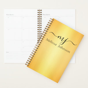 Elegant initials on gold planner