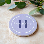 Elegant Lavender Purple Custom Monogram Initial Coaster<br><div class="desc">Elegant round personalised beverage drink coaster design features a classic custom serif monogram initial in red orange with your last name in modern white calligraphy script against a deep royal purple background. A simple white circle frames the design. Colour scheme can be customised to coordinate perfectly with your home decor....</div>