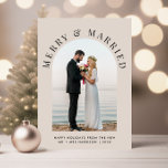 Elegant Married And Merry Arch Photo Christmas Holiday Card<br><div class="desc">Elegant light taupe wedding announcement Christmas holiday card for newlyweds featuring your photo in an arch frame,  "Merry & Married" in classic serif typography,  and your holiday greeting,  names and the year in simple modern typography.</div>