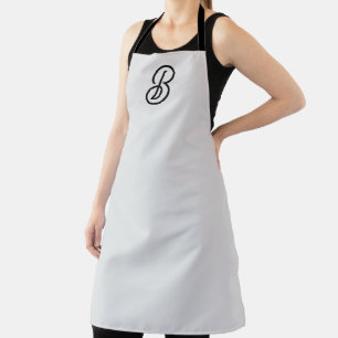 Elegant minimalist modern initial on gray apron