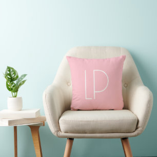 Elegant minimalist modern initial on pastel pink cushion