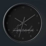 Elegant Modern Personalised With Name Monogram Clock<br><div class="desc">Elevate your home decor with our Blackout Sleek Elegant Modern Personalised With Name Monogram Clock. This finely crafted wall clock seamlessly blends contemporary aesthetics with a personalised touch, making it a stylish and functional addition to any room. Featuring your name and a monogram in a sleek blackout style, this clock...</div>