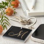 Elegant Monogram Gold Black  Keychain<br><div class="desc">Personalised key chain featuring a gold sans serif initial and name on a black background. Made of ultra-durable acrylic and UV resistant and waterproof. A trending modern minimalist typography style. Click on "customise further to use our simple design tool to choose a different initial or name font.</div>