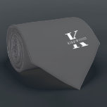 Elegant Monogram Gray | White Tie<br><div class="desc">An elegant necktie featuring a bold white monogram across a silver gray background. Atop this monogram sits your first or last name spelled out in all capitals. If you prefer a bolder look for the personal name inside of the large letter you can do the following: Use the customize/ edit...</div>