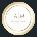 Elegant Monogrammed Gold Wedding Round Stickers<br><div class="desc">Minimalist,  yet elegant monogrammed gold wedding stickers featuring a gold frame surrounding all the important event details. These gold round stickers may be easily personalised to a wedding,  50th wedding anniversary,  or a birthday party,  for instance.</div>