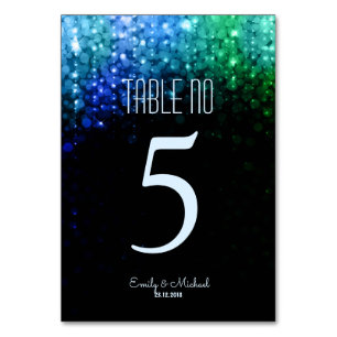 Elegant peacock colour lights bokeh table number